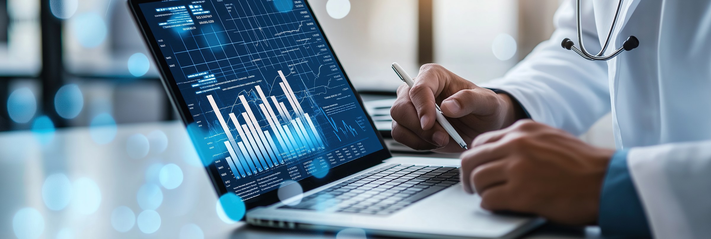 Healthcare professional reviewing analytics on a laptop